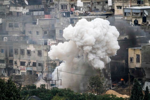 Israeli soldiers detonate an explosive device during a military raid in the West Bank refugee camp of Nur Shams, Tulkarem 