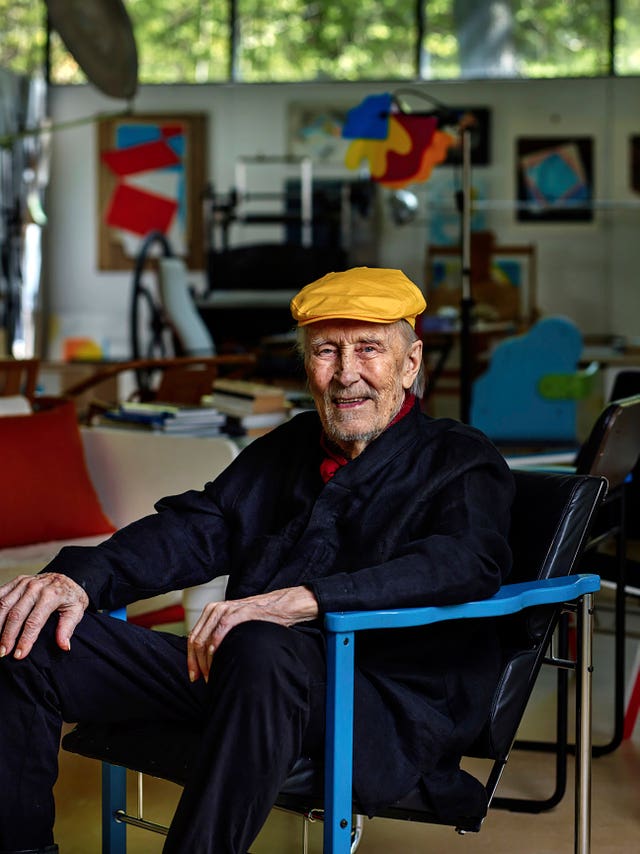 Yrjo Kukkapuro sitting in his famous Experiment chair in his studio outside Helsinki 