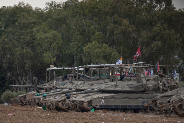 Israeli tanks at a staging area near the border with the Gaza Strip, in southern Israel