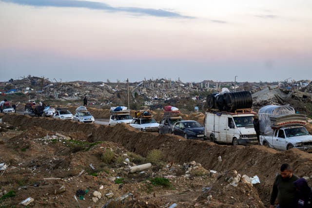 Displaced Palestinians make their way from central Gaza to their homes in the northern Gaza Strip