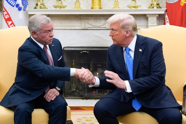 President Donald Trump greets Jordan’s King Abdullah II in the Oval Office at the White House