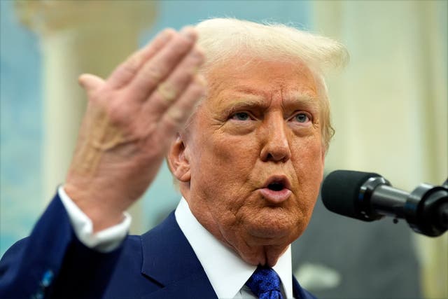 President Donald Trump speaks as Tulsi Gabbard is sworn in as the Director of National Intelligence in the Oval Office of the White House