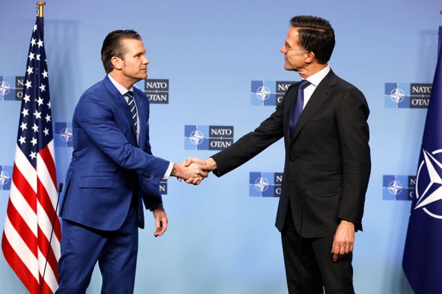 Nato secretary general Mark Rutte, right, shakes hands with US secretary of defence Pete Hegseth at Nato headquarters in Brussels 