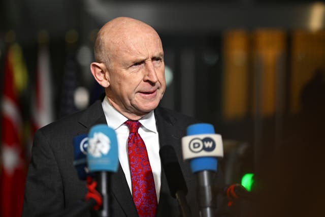 Defence Secretary John Healey speaks with the media as he arrives for a meeting of Nato defence ministers at Nato headquarters in Brussels 