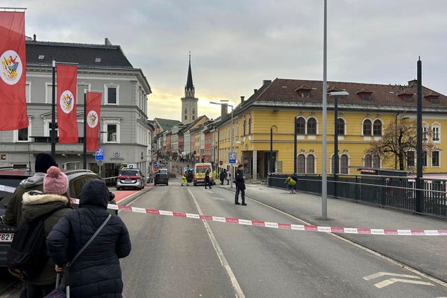 Cordoned off area, with people looking on