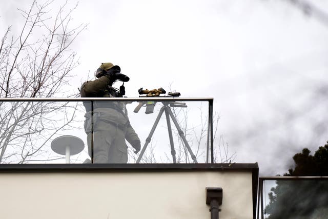 A security guard on a rooftop