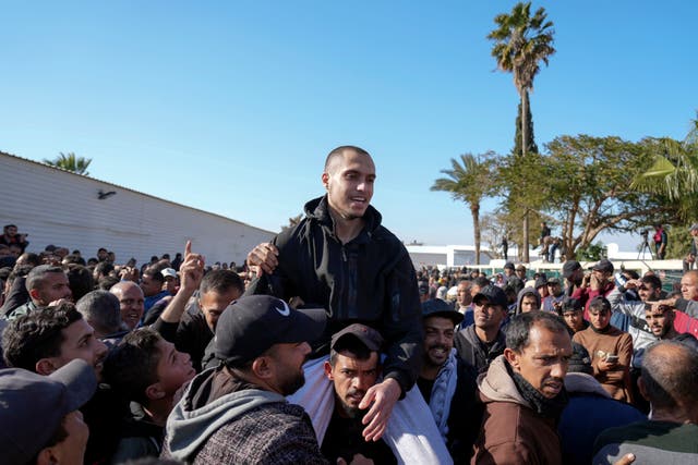 A freed Palestinian prisoner is greeted by a crowd