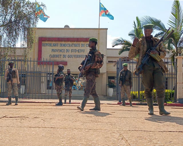 M23 rebels guard the South Kivu province administrative office in Bukavu