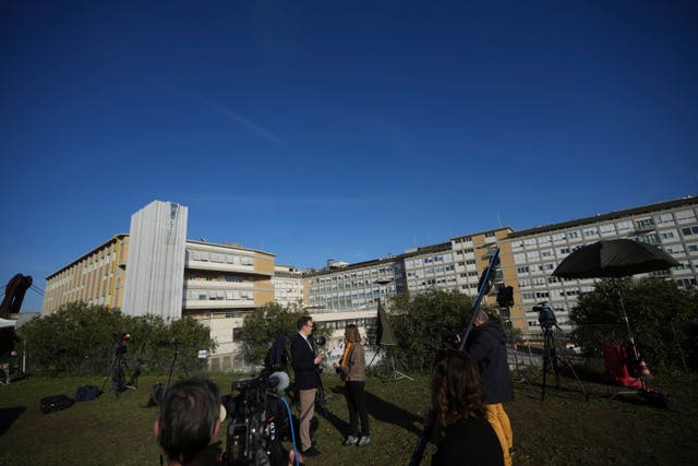 Journalists report from outside the Agostino Gemelli Polyclinic in Rome