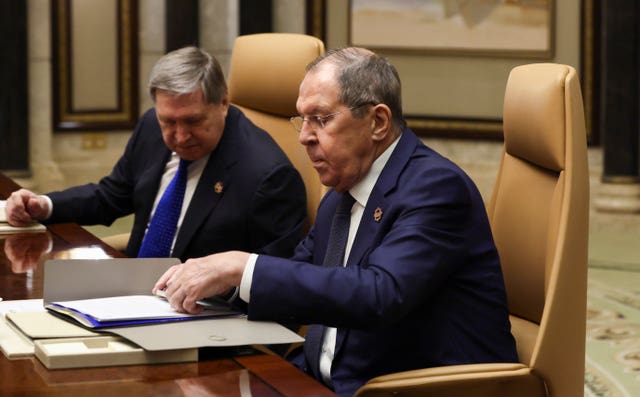 Russian foreign minister Sergei Lavrov, right, with Vladimir Putin’s foreign policy adviser Yuri Ushakov 