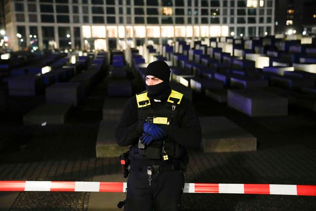 A police officer guards the cordoned off Holocaust Memorial in Berlin