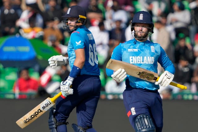 England’s Ben Duckett, right, and Joe Root run between the wickets