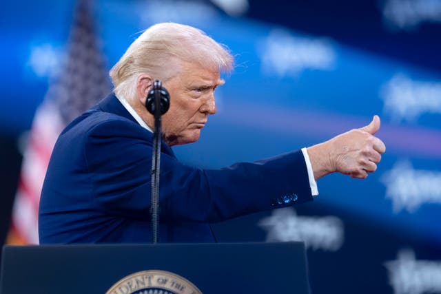 President Donald Trump gives a thumbs-up as he speaks at the Conservative Political Action Conference