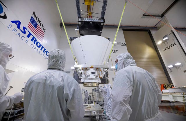 BAE Systems employees working on NASA’s SPHEREx observatory in the Astrotech Space Operations facility at Vandenberg Space Force Base in California 