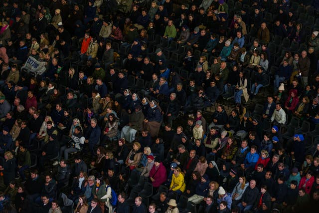 The faithful attend a nightly rosary prayer service for the health of Pope Francis