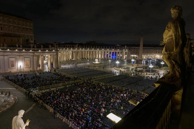 Catholic faithful attend a nightly rosary prayer service for the health of Pope Francis in St Peter’s Square 