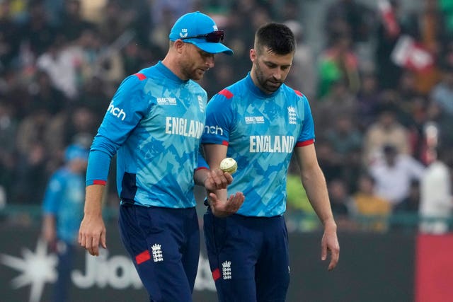 England’s Mark Wood, right, chats with Jos Buttler during the ICC Champions Trophy cricket match between Afghanistan and England