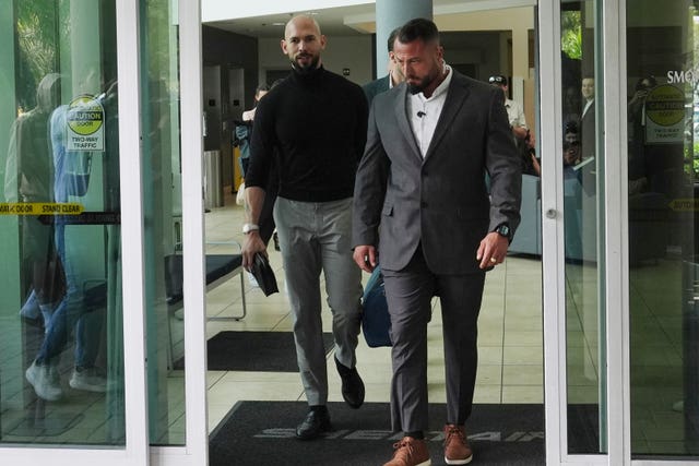 Influencer Andrew Tate, left, arrives, Thursday, Feb. 27, 2025, in Fort Lauderdale, Florida