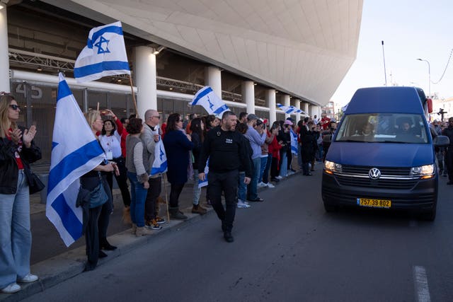 People line the funeral route