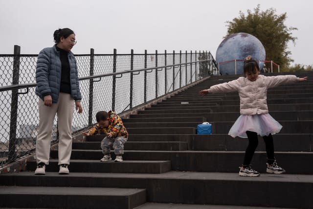 Visitors enjoy the roof top walk way at the West Village project by Pritzker Architecture Prize winner Chinese architect Liu Jiakun in Chengdu in southwestern China