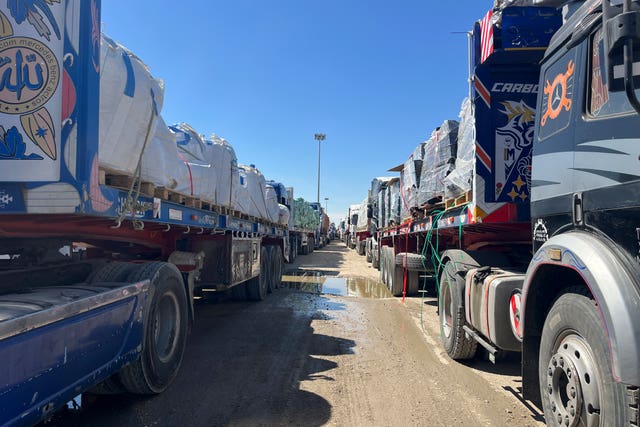 Trucks line up at the Egyptian side of the Rafah border crossing between Egypt and the Gaza Strip after Israel blocked the entry of aid trucks into Gaza 