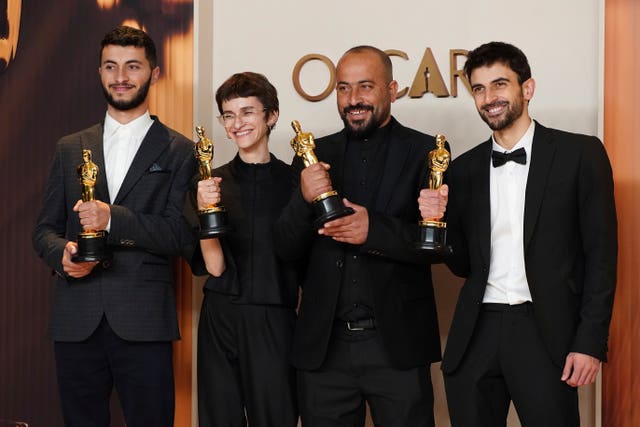 Basel Adra, from left, Rachel Szor, Hamdan Ballal, and Yuval Abraham, winners of the award for best documentary feature film for No Other Land, pose in the press room at the Oscars at the Dolby Theatre in Los Angeles 