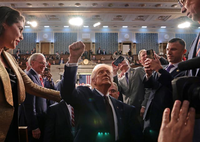 Donald Trump gestures in triumph