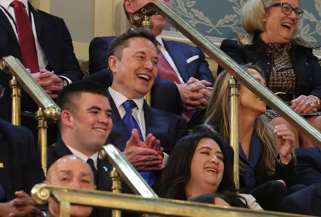 Elon Musk claps as President Donald Trump addresses a joint session of Congress