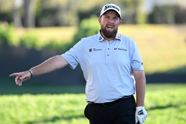 Shane Lowry, of Ireland, shouts after hitting his tee shot on the 18th hole 