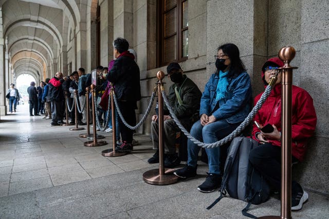 People wait in line outside the Court of Final Appeal in Hong Kong