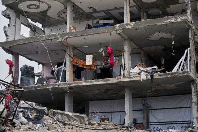 Laundry hangs on ropes strung across a wall-less apartment in Jabaliya 