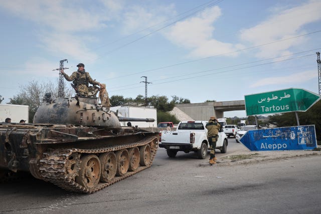  Syrian security forces, including a tank