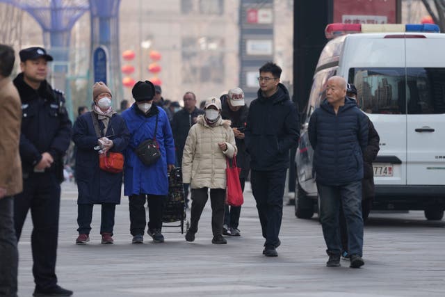 Family members of passengers who were on board the MH370 Malaysia Airline jet that went missing in 2014 leave after meeting Chinese Foreign Ministry officials in Beijing