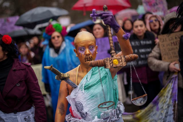 A woman in a colourful dress on International Women’s Day in Spain