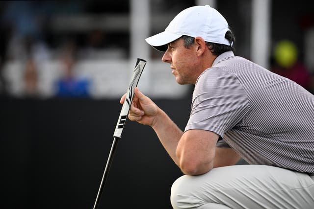 Rory McIlroy lines up a putt