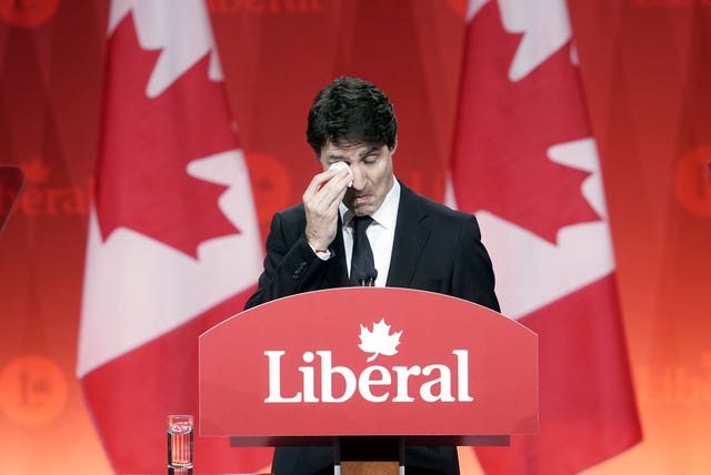 Prime Minister Justin Trudeau wipes away tears