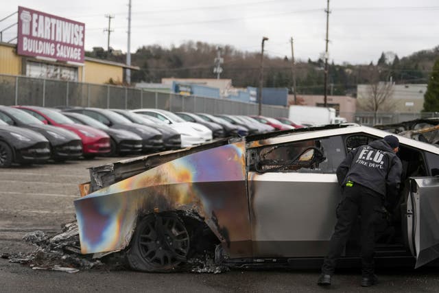 A burned Tesla Cybertruck at a Tesla lot
