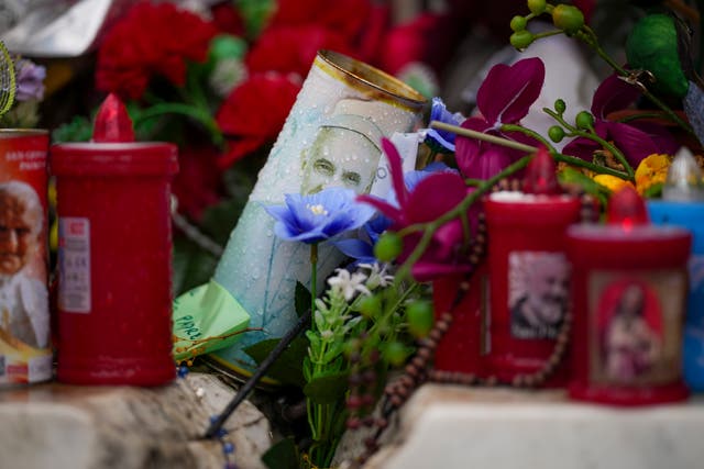 Candles and flowers for Pope Francis left outside the Agostino Gemelli Polyclinic, in Rome 