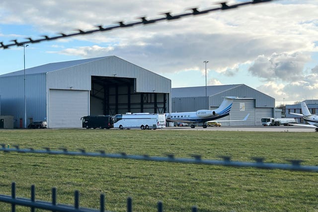 A plane believed to be carrying Mr Duterte parked next to a bus at Rotterdam The Hague Airport in the Netherlands on Wednesday 