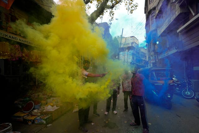 Millions of people celebrate Holi, the Hindu festival of colours ...