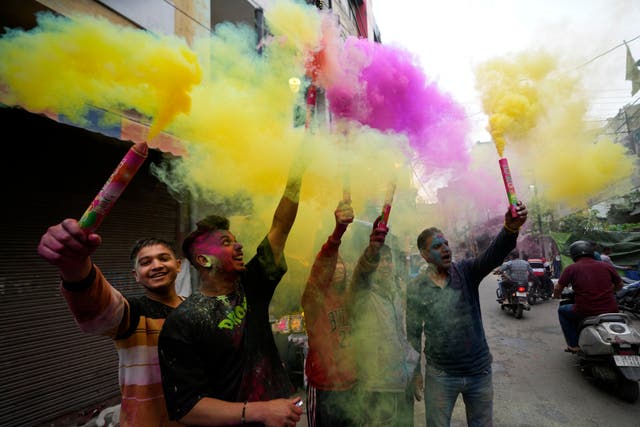 Indians play with colours as they celebrate Holi in Jammu