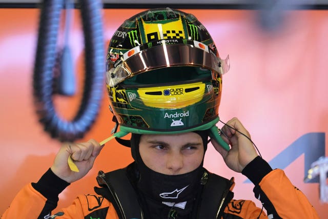 McLaren driver Oscar Piastri of Australia puts his helmet on during qualifying