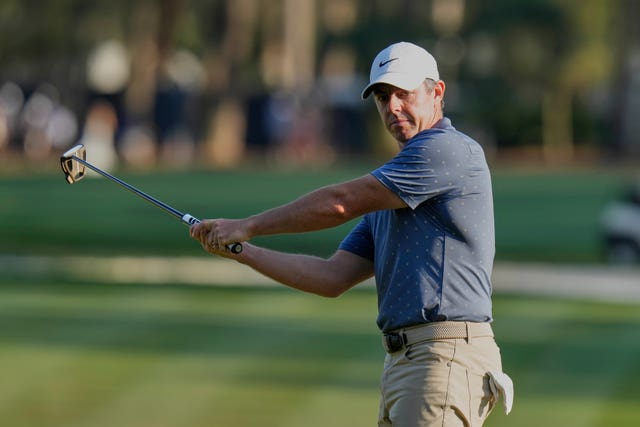 Rory McIlroy reacts after missing his birdie putt on the 15th 