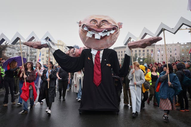 Effigies representing protesters’ demands are displayed during a major rally against populist President Aleksandar Vucic and his government