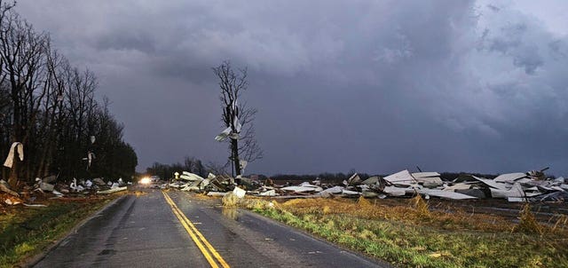 Debris covers the road during a severe storm passed the area north of Seymour, Missouri