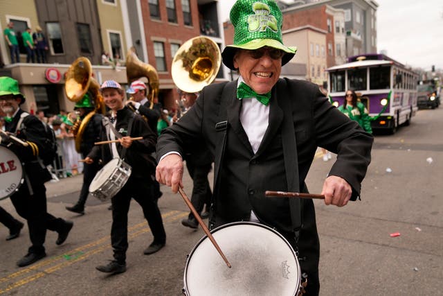 A drummer performing during a parade