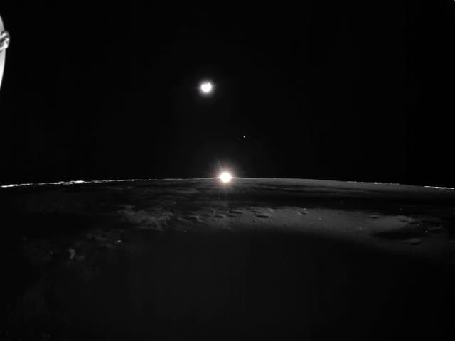 The sun setting on the Moon, with Earth and Venus in the distance 