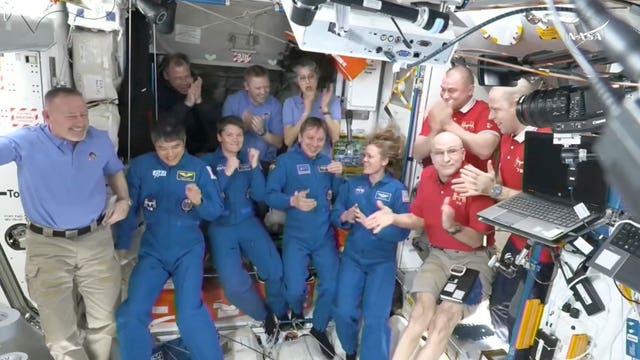 Group of astronauts smiling on ISS