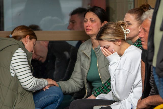  woman cries outside a hospital in the town of Kocani,