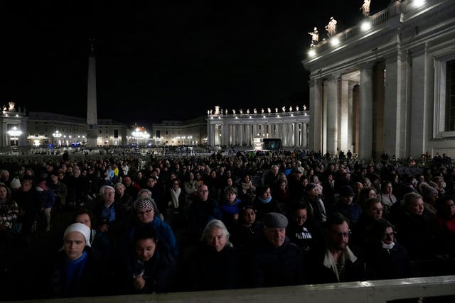 Faithful pray in St Peter’s Square at the Vatican during a vigil rosary for the recovery of Pope Francis